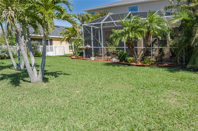 view of yard with a lanai