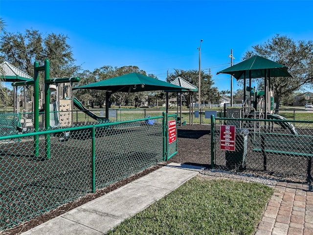 community jungle gym featuring fence