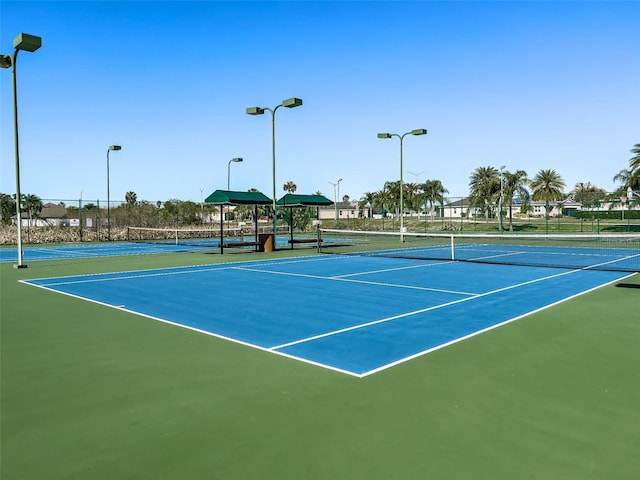 view of sport court with fence