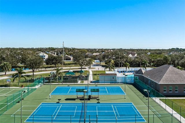 view of sport court with fence