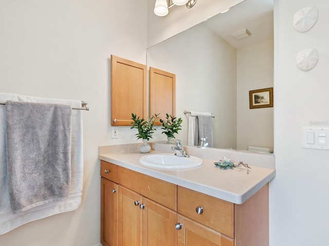 bathroom featuring visible vents and vanity