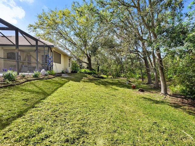 view of yard featuring a lanai