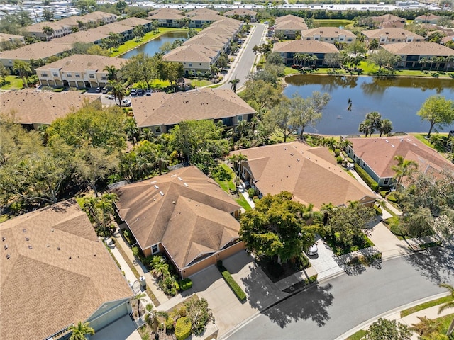 bird's eye view with a residential view and a water view