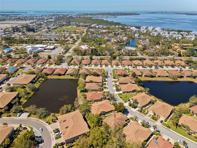 aerial view featuring a residential view and a water view