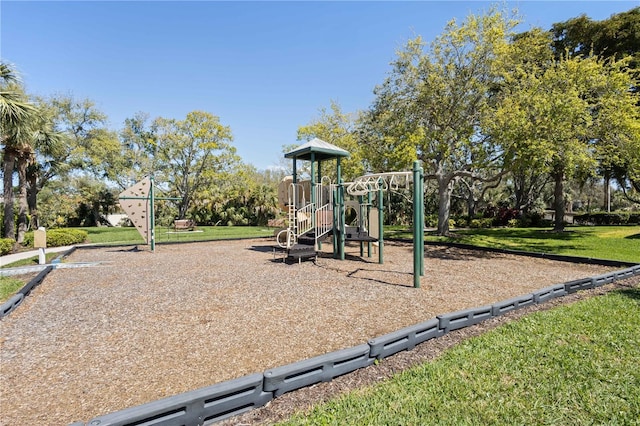 community jungle gym with a lawn