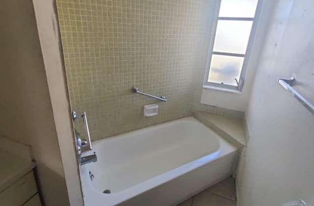 bathroom featuring a washtub and tile patterned floors