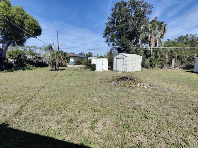 view of yard with an outbuilding and a storage unit