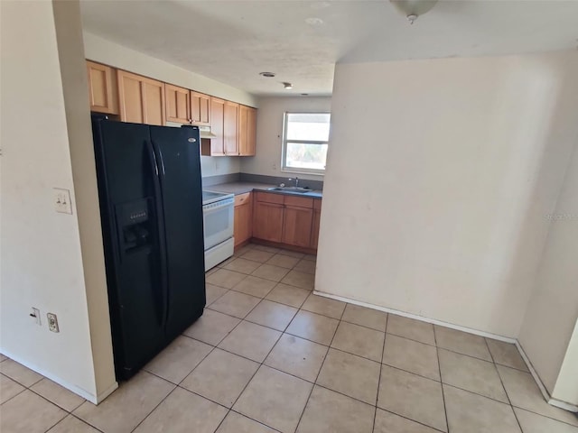 kitchen featuring black refrigerator with ice dispenser, electric range, light brown cabinets, light tile patterned flooring, and a sink