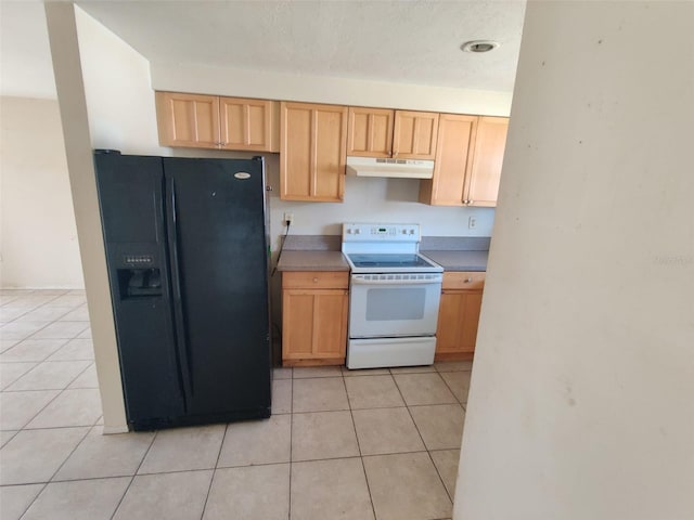 kitchen with light tile patterned floors, white range with electric cooktop, light brown cabinetry, under cabinet range hood, and black fridge