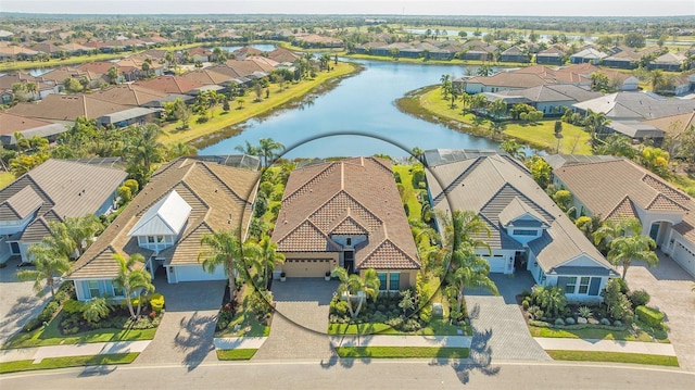 birds eye view of property with a residential view and a water view
