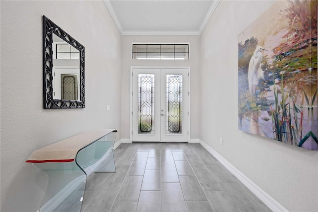 entryway featuring french doors, ornamental molding, and baseboards