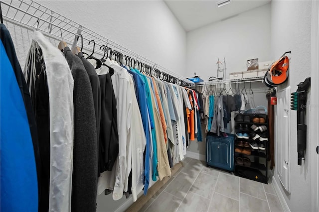 spacious closet with tile patterned flooring