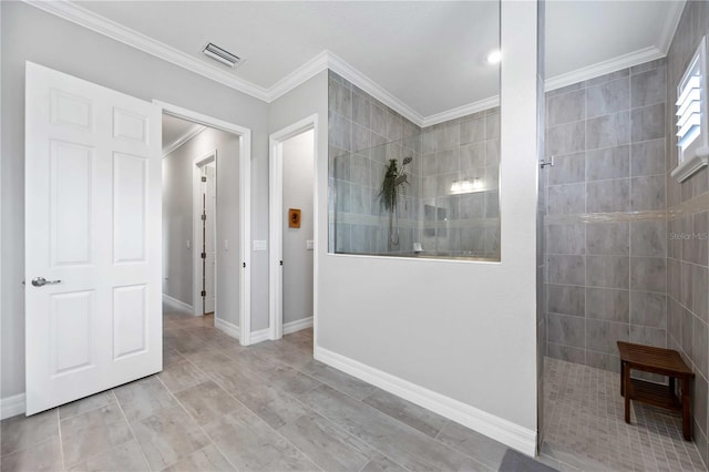 bathroom with baseboards, visible vents, walk in shower, and ornamental molding