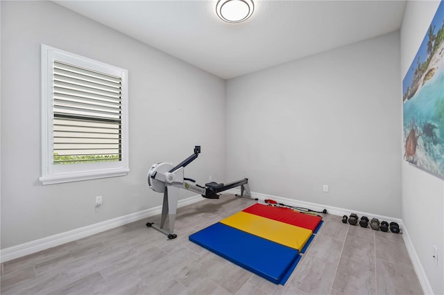 exercise room with baseboards