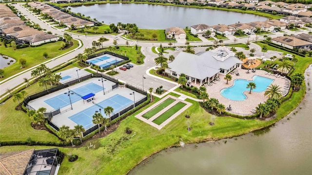 bird's eye view featuring a residential view and a water view