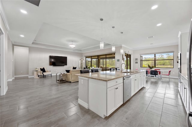 kitchen with dishwasher, a sink, an island with sink, baseboards, and light stone counters