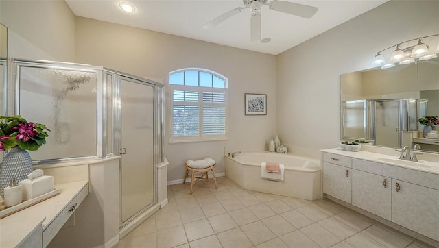 bathroom with a stall shower, tile patterned flooring, a bath, and vanity