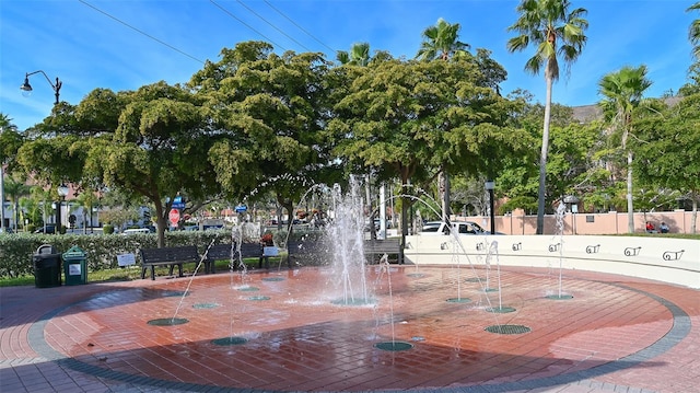 view of community with fence