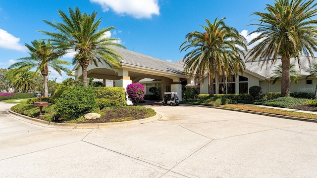 view of building exterior with concrete driveway