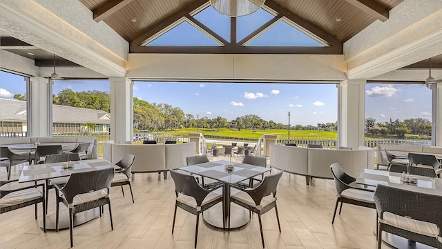 sunroom with wood ceiling and lofted ceiling with beams