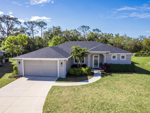 ranch-style home featuring stucco siding, an attached garage, driveway, and a front yard