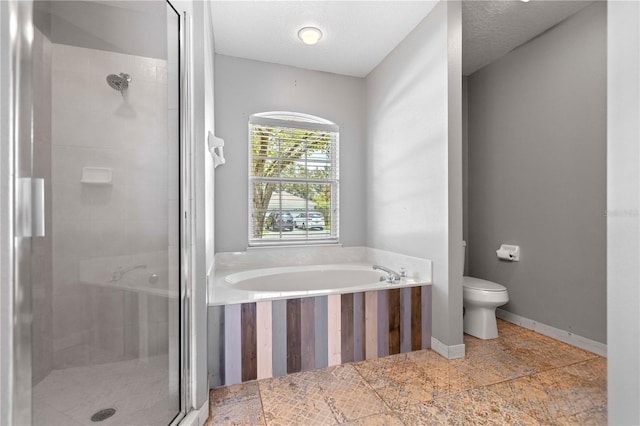 full bath featuring baseboards, toilet, a textured ceiling, a shower stall, and a bath