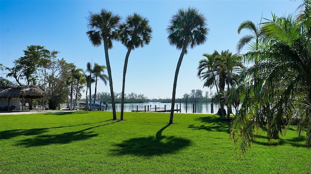 surrounding community featuring a water view, a gazebo, and a yard