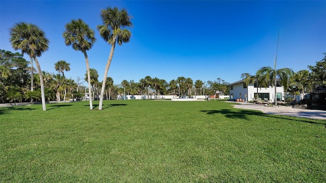 view of property's community with a yard