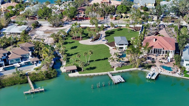 drone / aerial view with a water view and a residential view