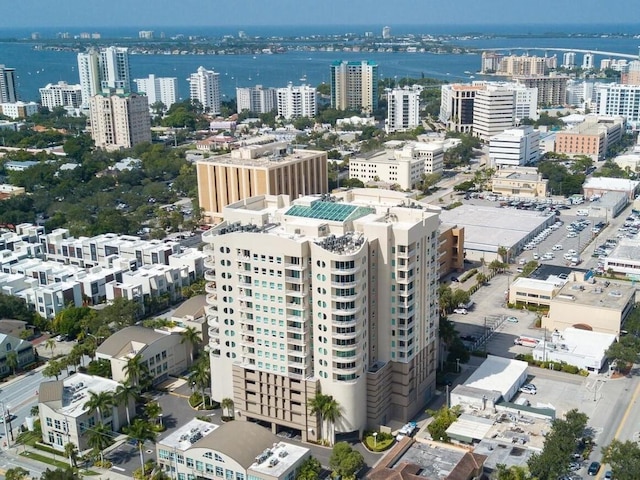 birds eye view of property featuring a city view and a water view