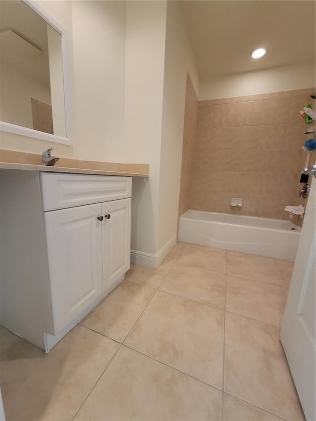 bathroom featuring shower / bath combination, baseboards, tile patterned floors, vanity, and recessed lighting