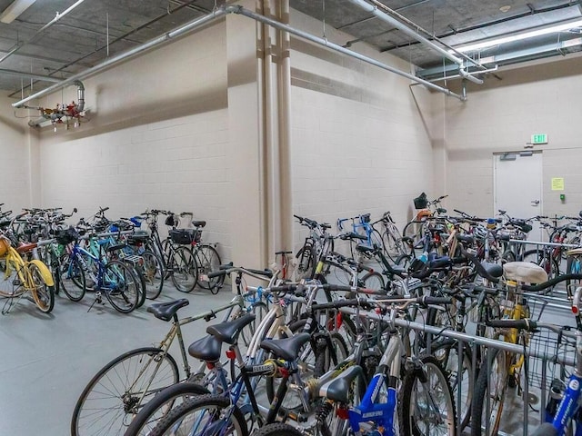 garage featuring concrete block wall and bike storage