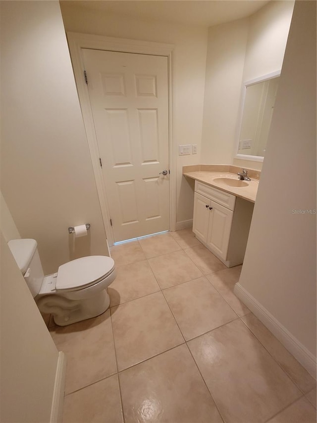 1771 Ringling Blvd Unit 902, Sarasota, FL 34236 - half bath with toilet, tile patterned flooring, vanity, and baseboards