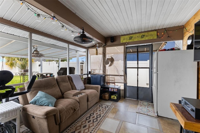 sunroom featuring wood ceiling, ceiling fan, and track lighting