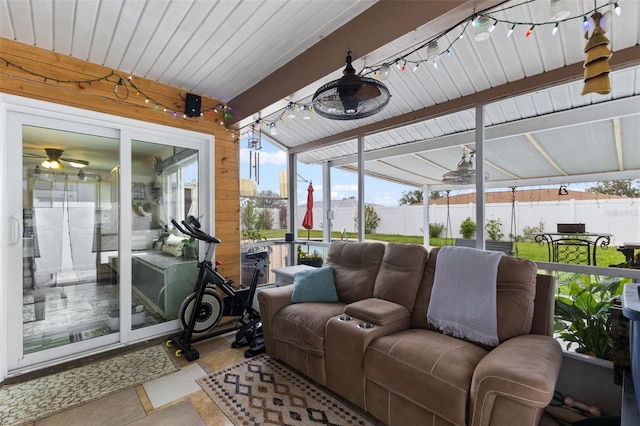 sunroom featuring track lighting and a ceiling fan