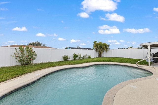 view of pool with a yard, a fenced in pool, and a fenced backyard