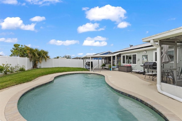 view of pool with a fenced backyard, a yard, a grill, a fenced in pool, and a patio area