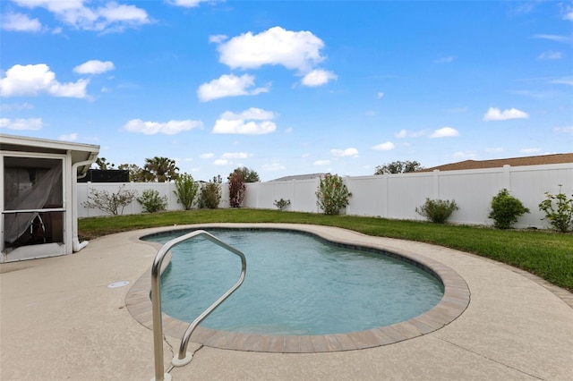 view of pool featuring a patio area, a yard, a fenced backyard, and a fenced in pool