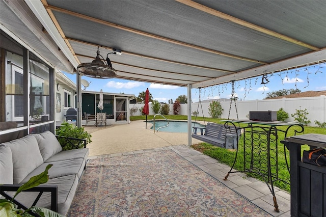 view of patio / terrace with a fenced in pool, an outdoor hangout area, a fenced backyard, and a sunroom