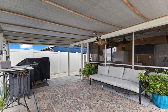 view of patio with an outdoor hangout area and fence