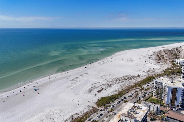 aerial view with a water view and a beach view