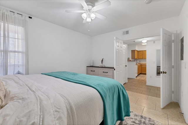 bedroom with visible vents, ceiling fan, and light tile patterned flooring