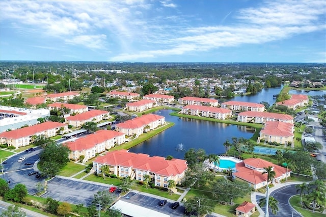 birds eye view of property featuring a water view and a residential view