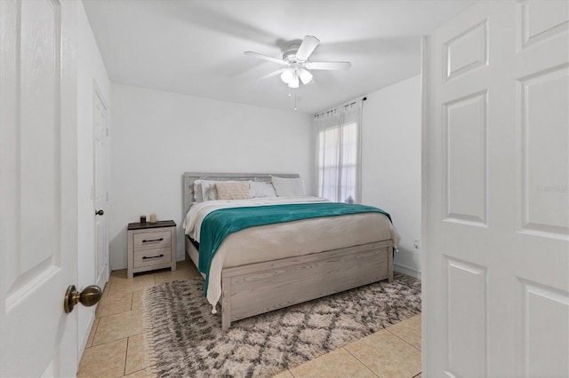 bedroom featuring tile patterned flooring and ceiling fan