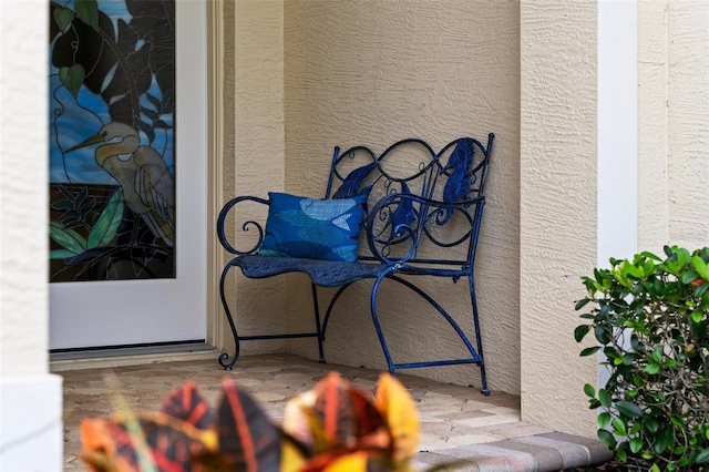 property entrance with stucco siding