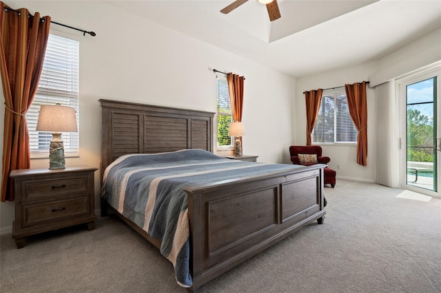 bedroom with access to exterior, light colored carpet, ceiling fan, and baseboards