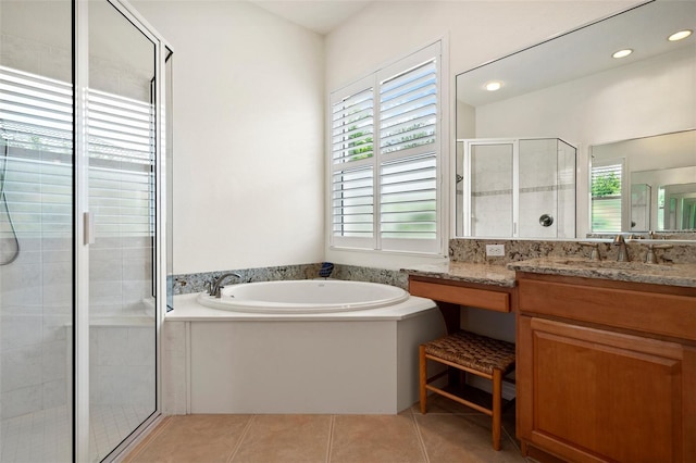 bathroom with a garden tub, recessed lighting, a stall shower, vanity, and tile patterned flooring