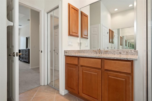 bathroom featuring tile patterned flooring, vanity, and recessed lighting