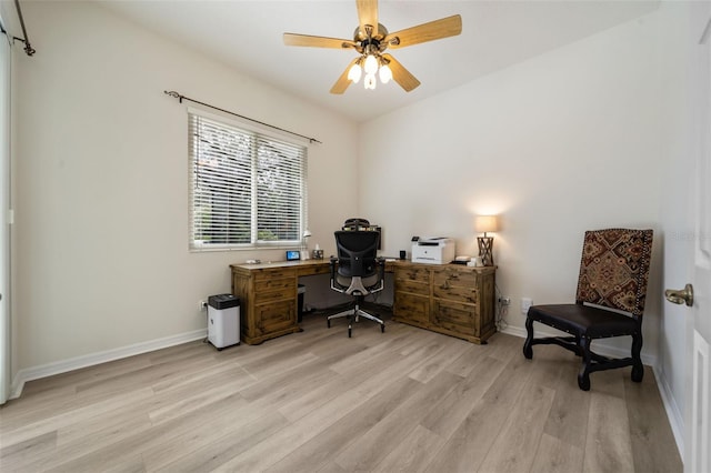 office area featuring light wood-style flooring, baseboards, and a ceiling fan