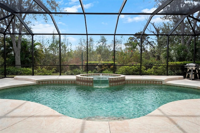 view of swimming pool with a pool with connected hot tub, a patio area, and a lanai